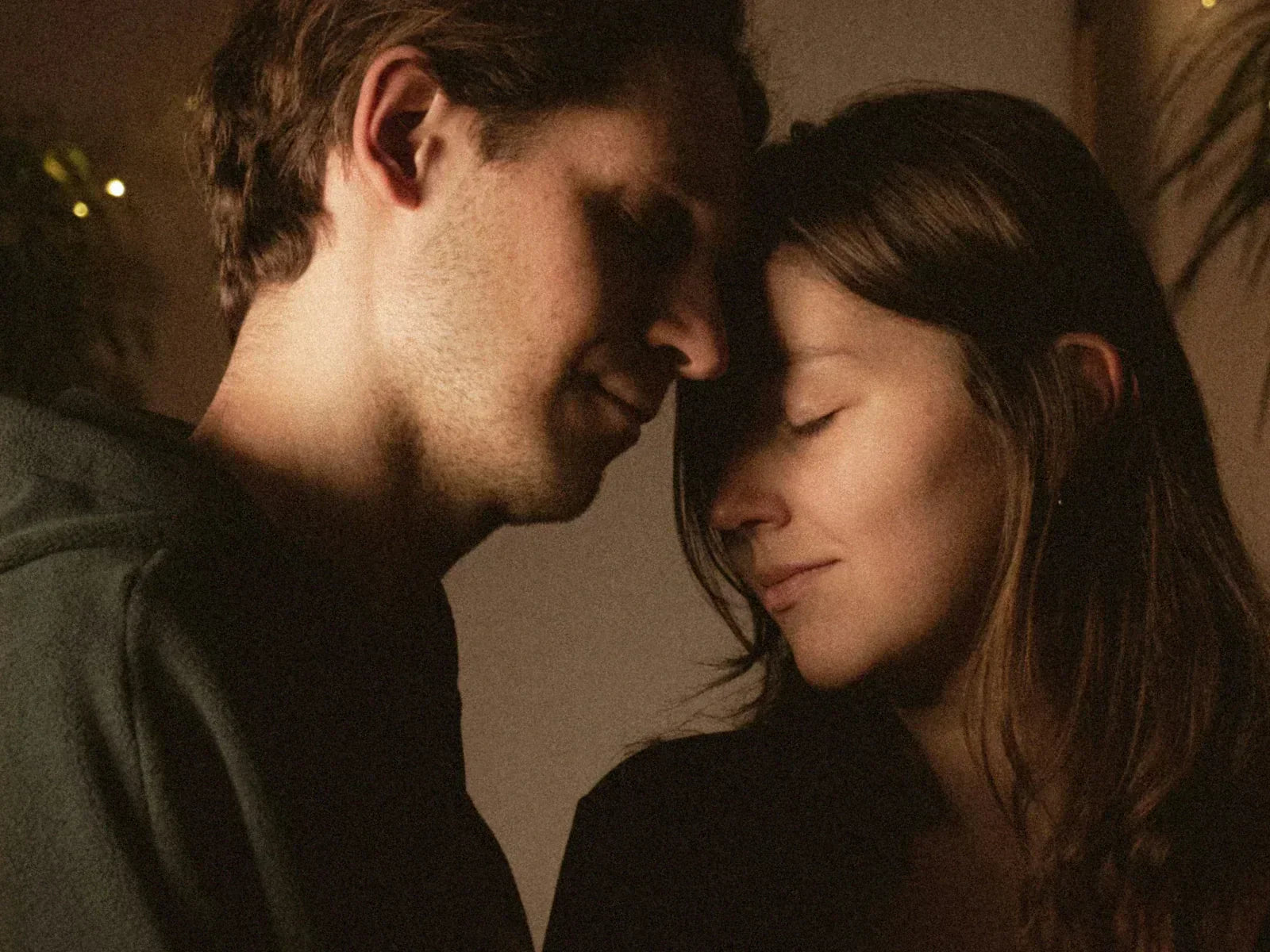 A couple in a close and intimate moment with warm light — representing the deep human connection that lies at the heart of the five love languages and the art of giving a gift that truly speaks to someone